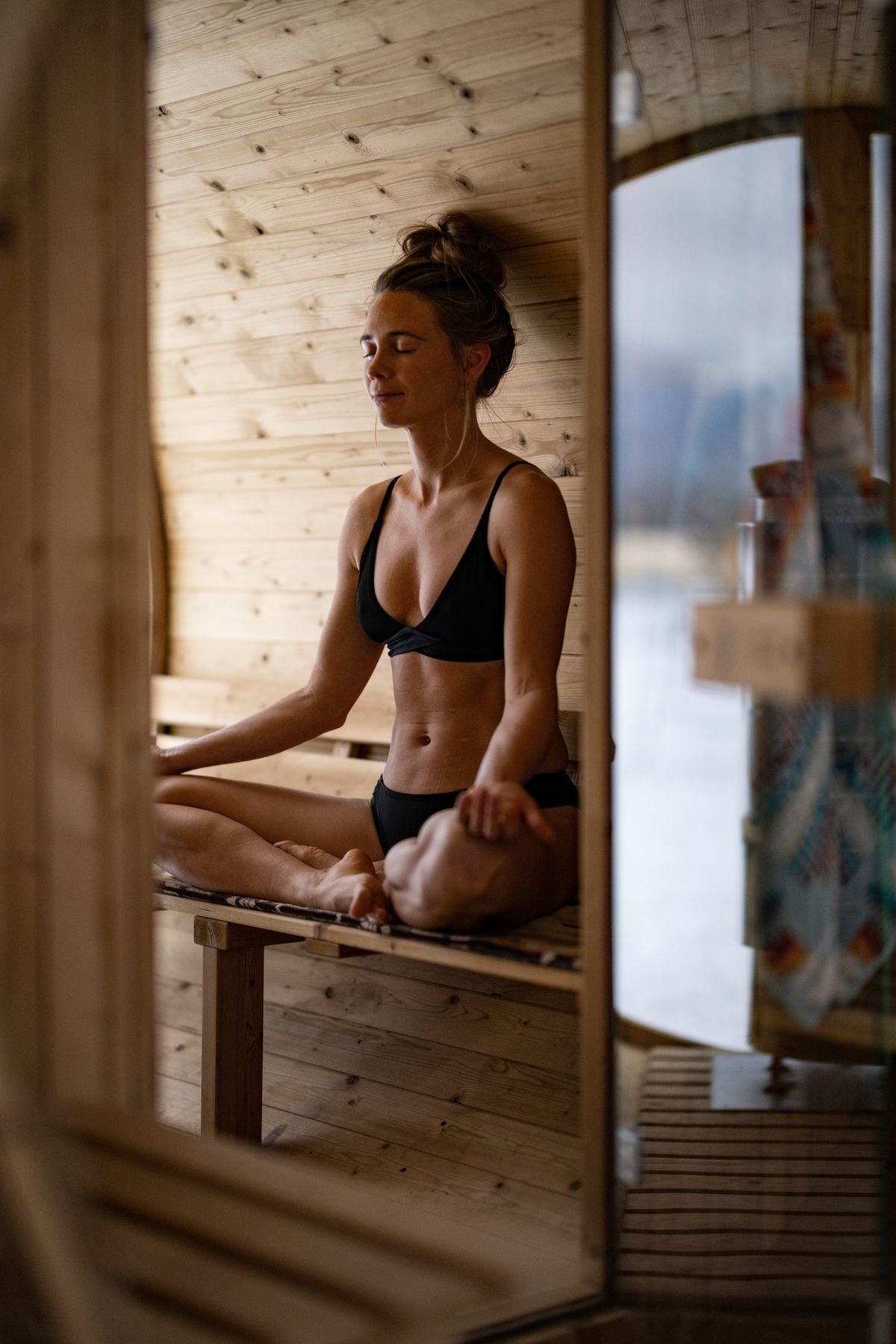 Woman meditating peacefully after contrast therapy session